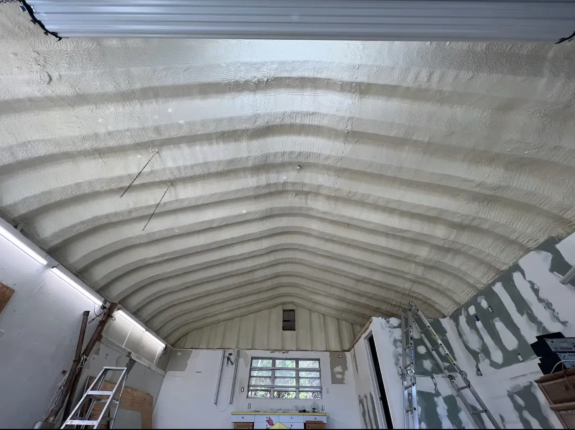 Spray polyurethane foam applied to the underside of a metal roof deck in St. Marys